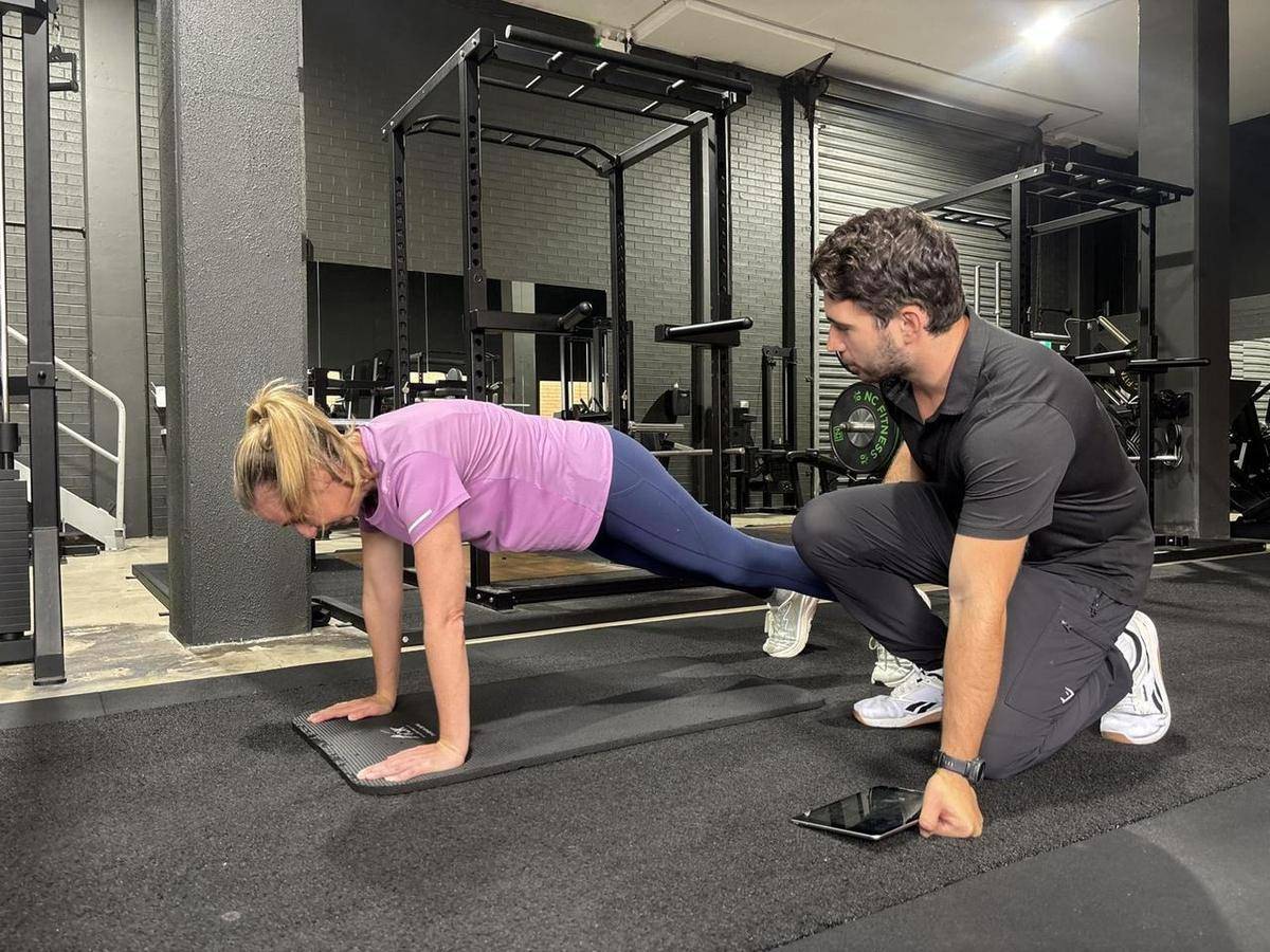 Max assessing a client’s push-up during an initial movement assessment