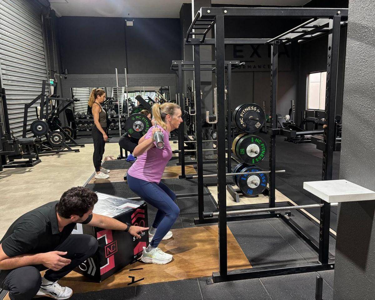 Strength Training Northern Beaches — Solve PT Max coaching a client through a back squat at Solve Personal Training, Brookvale